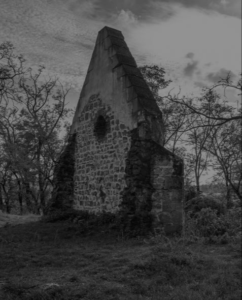 The Csévharaszti Puszta Church — stone ruin standing alone in the field